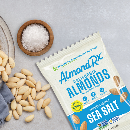 1 ounce package of almonds with bowl of skinless almonds and course sea salt.