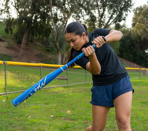 Kaylee Oh, SDSU star outfielder, taking a big swing.