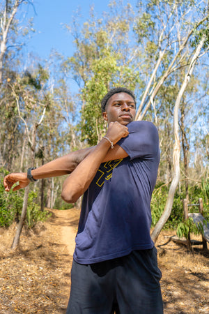 Kenneth Tucker, UCSD track star, stretching.
