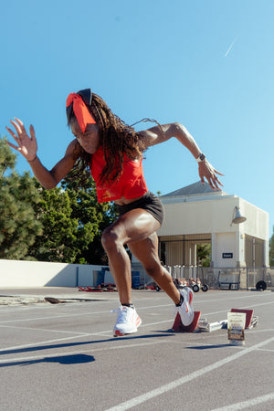 Takiyah Blue, sprinter for SDSU, taking off from the starting block.